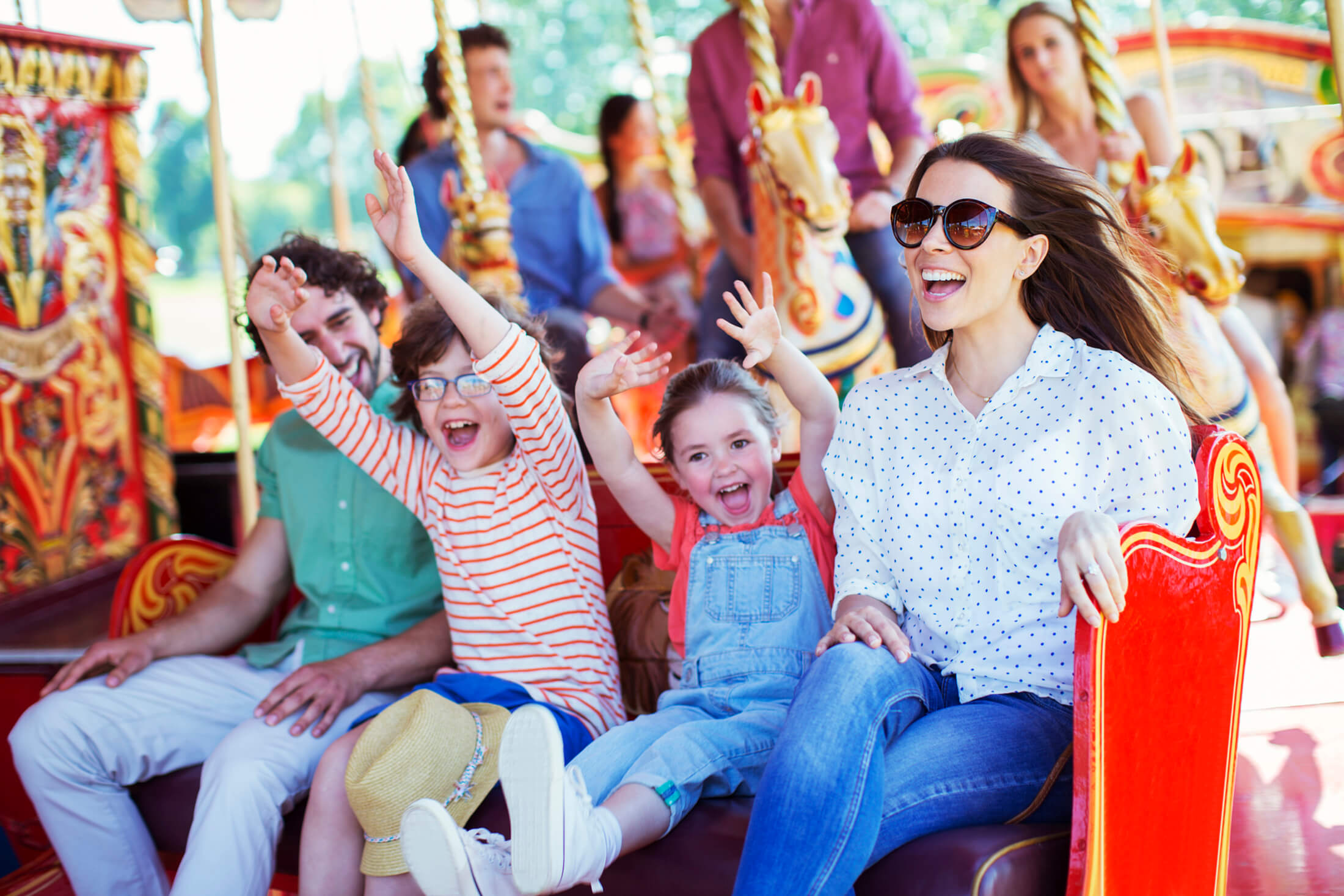 a family on a ride at an amusement park