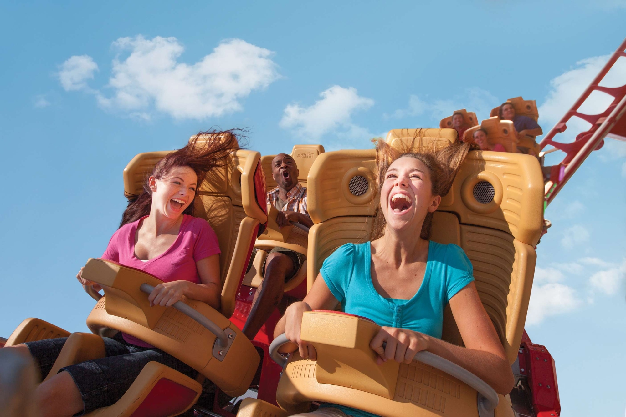 Two friends enjoying a roller coaster ride