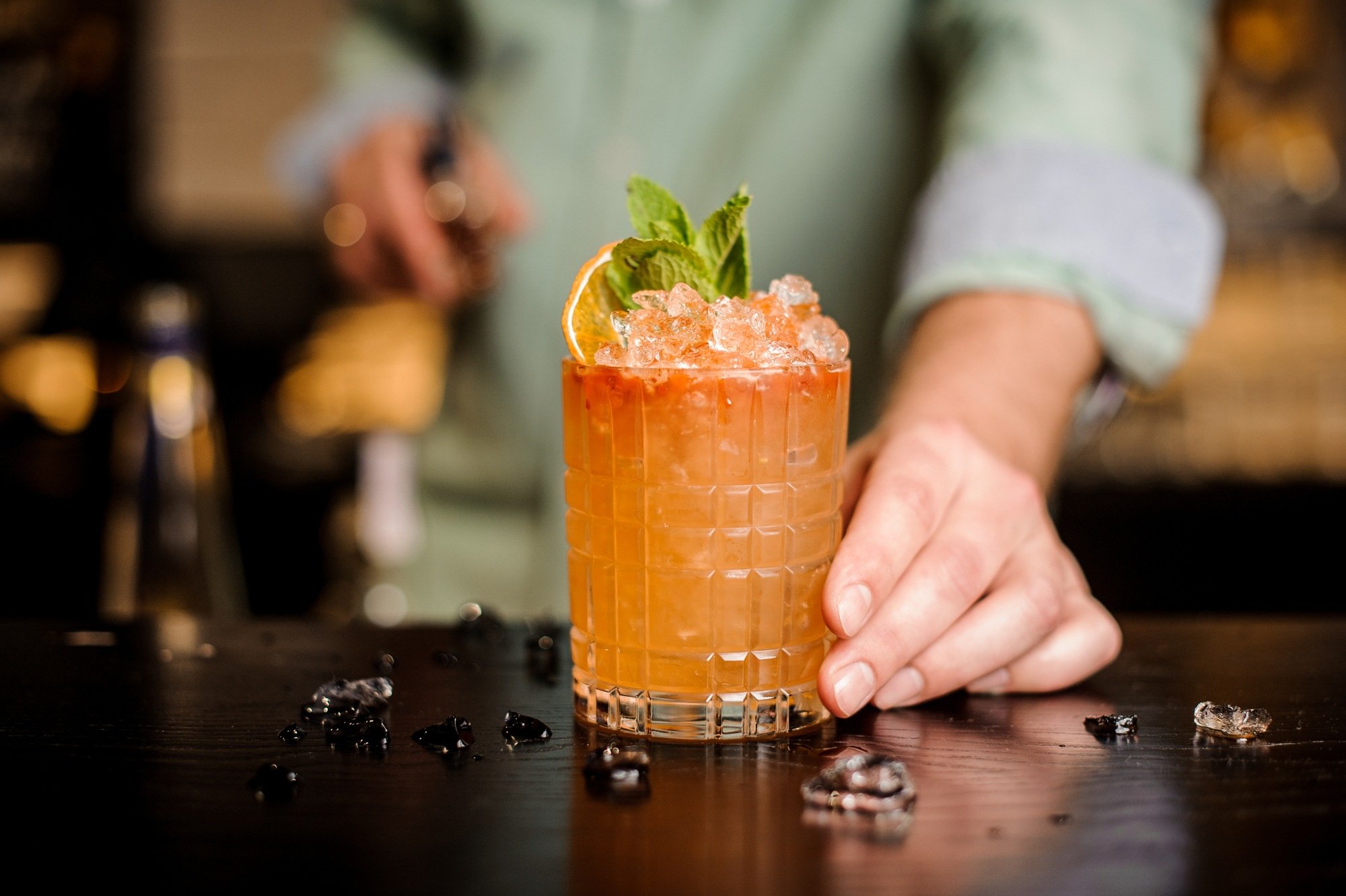 A bartender mixes a refreshing cocktail