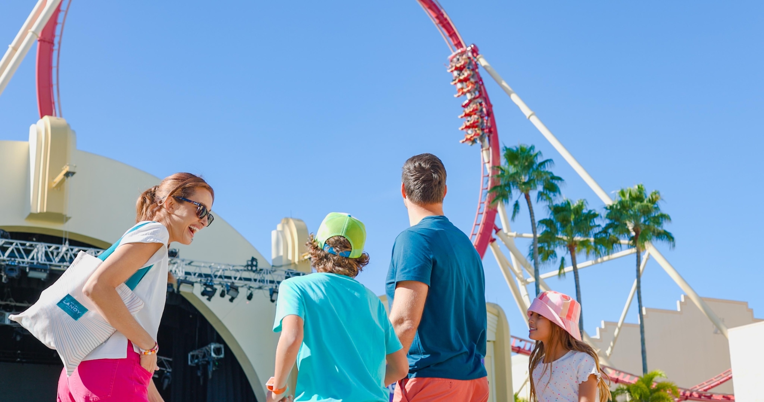 Family standing in front of a rollercoaster at Universal Orlando